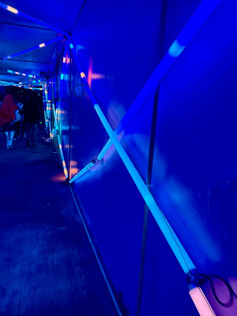 An underground tunnel at a trance festival.